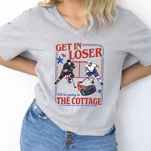 May include Get In Loser, We're Going to the Cottage v-neck tee with hockey romance BookTok graphic and relaxed fit