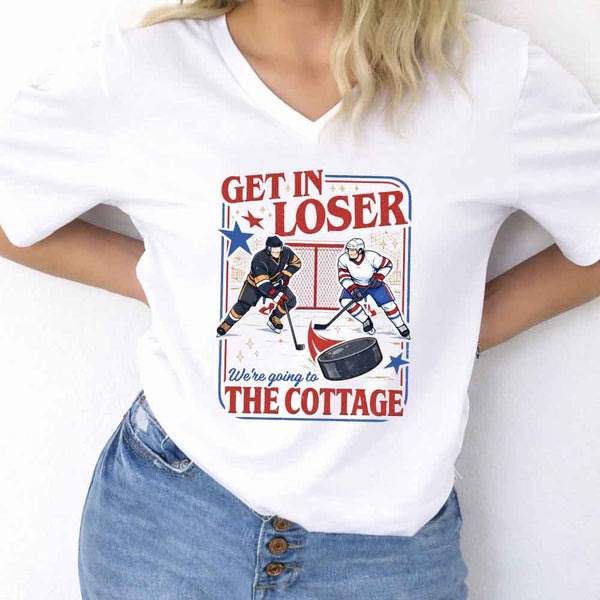 May include Get In Loser, We're Going to the Cottage v-neck tee with hockey romance BookTok graphic and relaxed fit