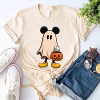 Beige t-shirt with ghost and pumpkin design, paired with jeans and sneakers on a light background.