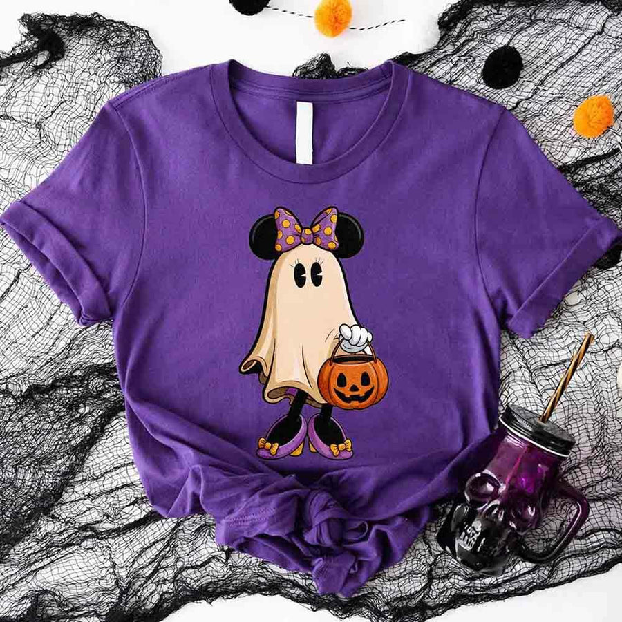 Purple t-shirt with a ghost design holding a pumpkin on a Halloween-themed background