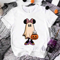 White t-shirt with a ghost character wearing a bow tie and holding a pumpkin, on a Halloween-themed background.