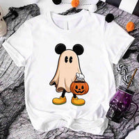 White t-shirt with a ghost character holding a pumpkin bucket on a Halloween-themed background.