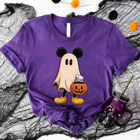 Purple t-shirt with a ghost wearing Mickey Mouse ears and holding a pumpkin on a Halloween-themed background.