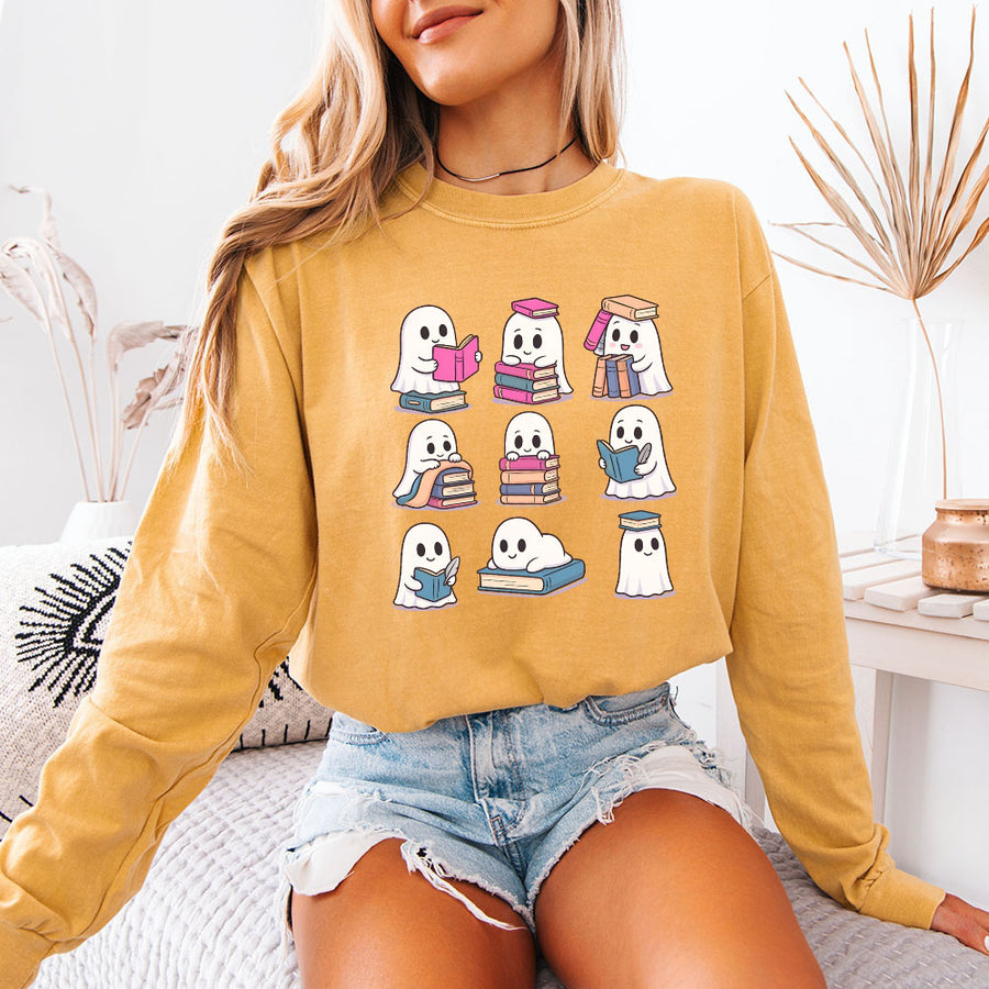 May include Ghost Reading Comfort Colors Halloween long sleeve shirt with ghost reading a book graphic, garment-dyed cotton, and relaxed unisex fit