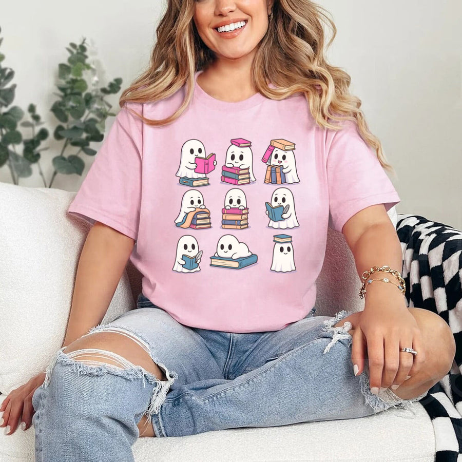 May include Ghost Reading Halloween shirt with cute ghost reading a book graphic, classic unisex fit, and soft cotton fabric