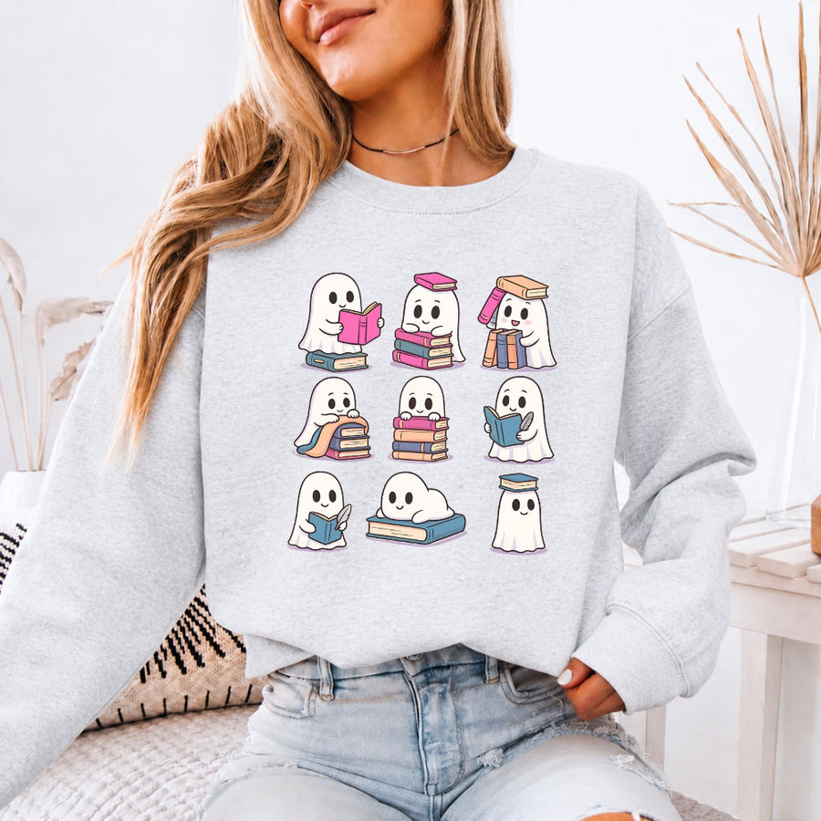 May include Ghost Reading Halloween crewneck sweatshirt with cute ghost reading a book graphic and classic unisex fleece fit