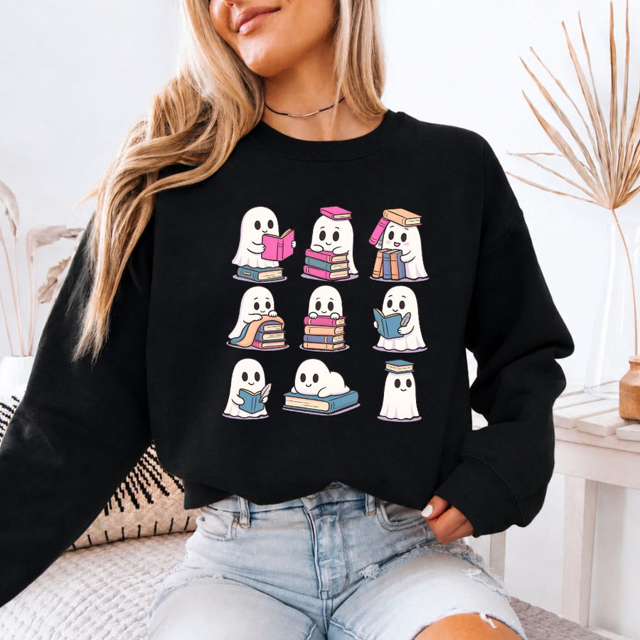 May include Ghost Reading Halloween crewneck sweatshirt with cute ghost reading a book graphic and classic unisex fleece fit