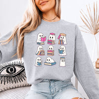 May include Ghost Reading Halloween crewneck sweatshirt with cute ghost reading a book graphic and classic unisex fleece fit