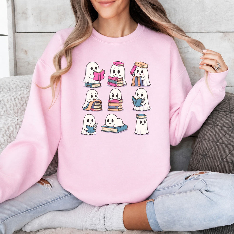 May include Ghost Reading Halloween crewneck sweatshirt with cute ghost reading a book graphic and classic unisex fleece fit