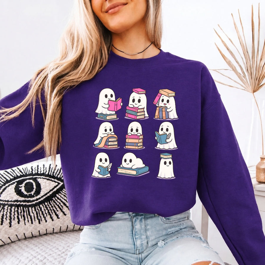 May include Ghost Reading Halloween crewneck sweatshirt with cute ghost reading a book graphic and classic unisex fleece fit