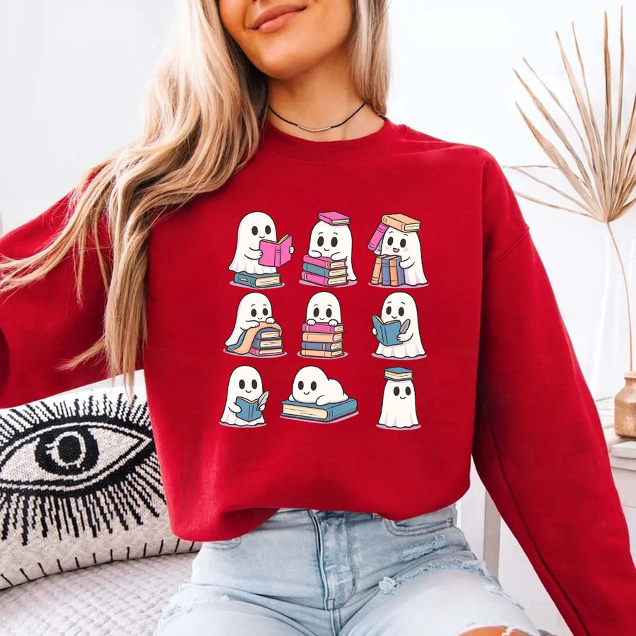 May include Ghost Reading Halloween crewneck sweatshirt with cute ghost reading a book graphic and classic unisex fleece fit