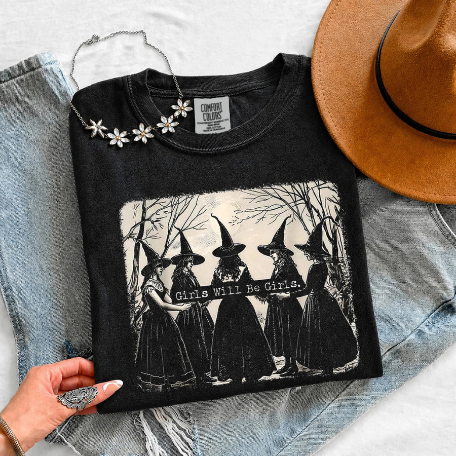 May include Girls Will Be Girls Comfort Colors Halloween t-shirt with festive graphic and relaxed unisex garment-dyed fit