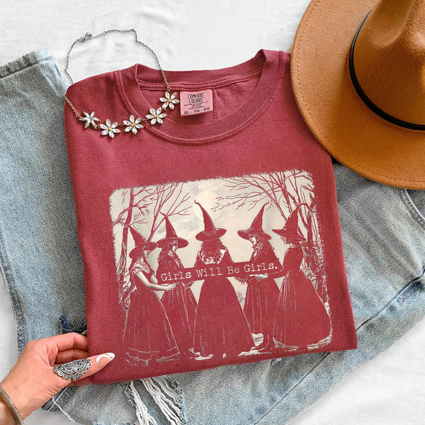 May include Girls Will Be Girls Comfort Colors Halloween t-shirt with festive graphic and relaxed unisex garment-dyed fit