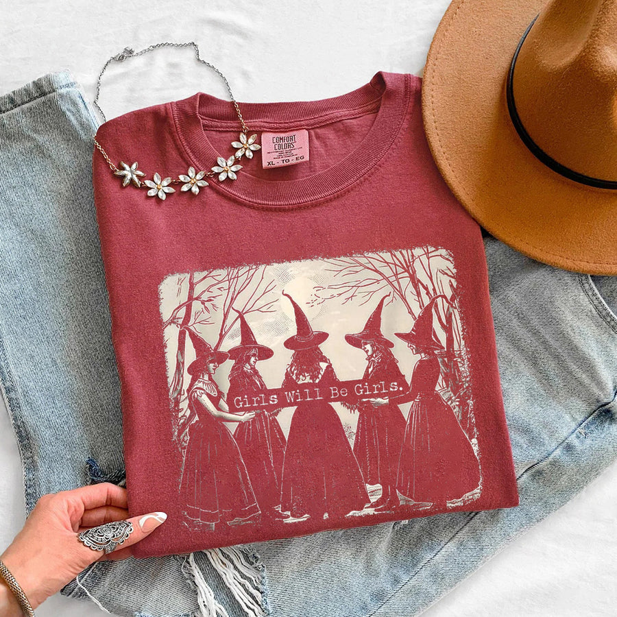 May include Girls Will Be Girls Comfort Colors Halloween t-shirt with festive graphic and relaxed unisex garment-dyed fit