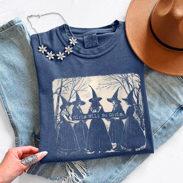 May include Girls Will Be Girls Comfort Colors Halloween t-shirt with festive graphic and relaxed unisex garment-dyed fit