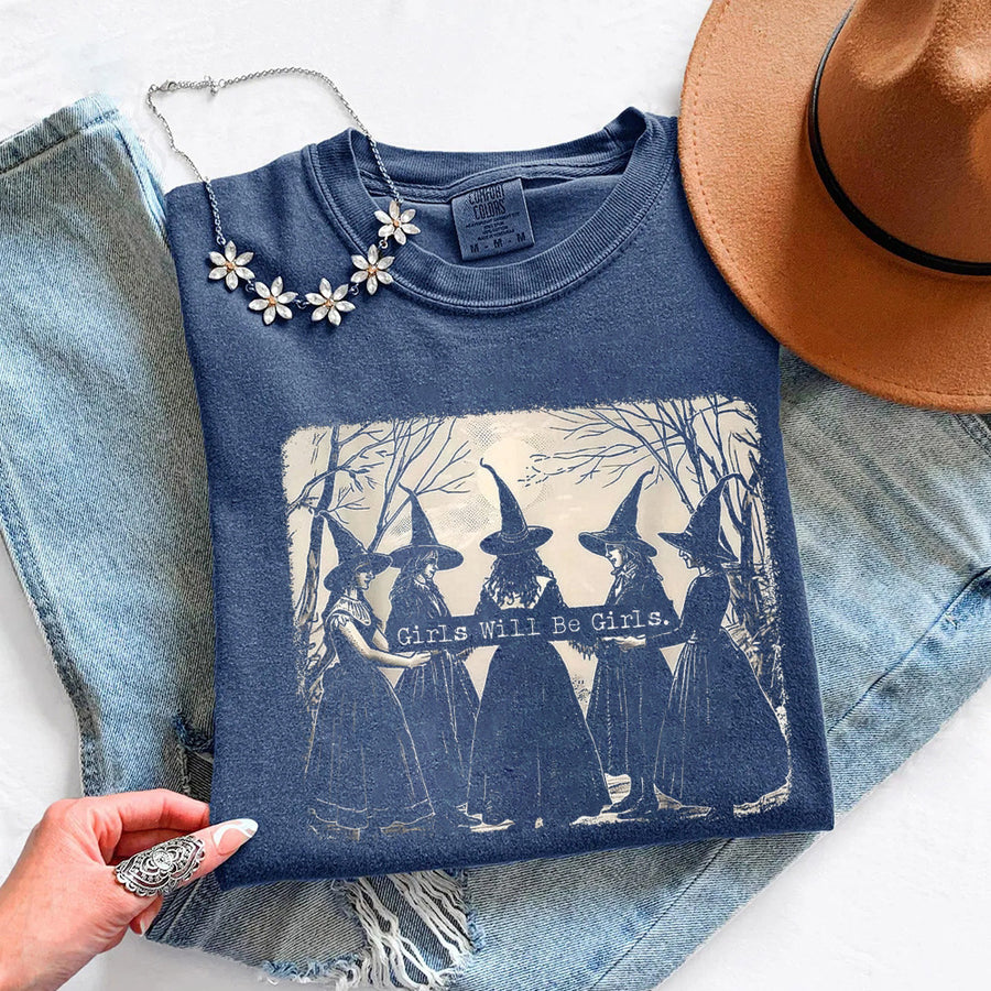May include Girls Will Be Girls Comfort Colors Halloween t-shirt with festive graphic and relaxed unisex garment-dyed fit