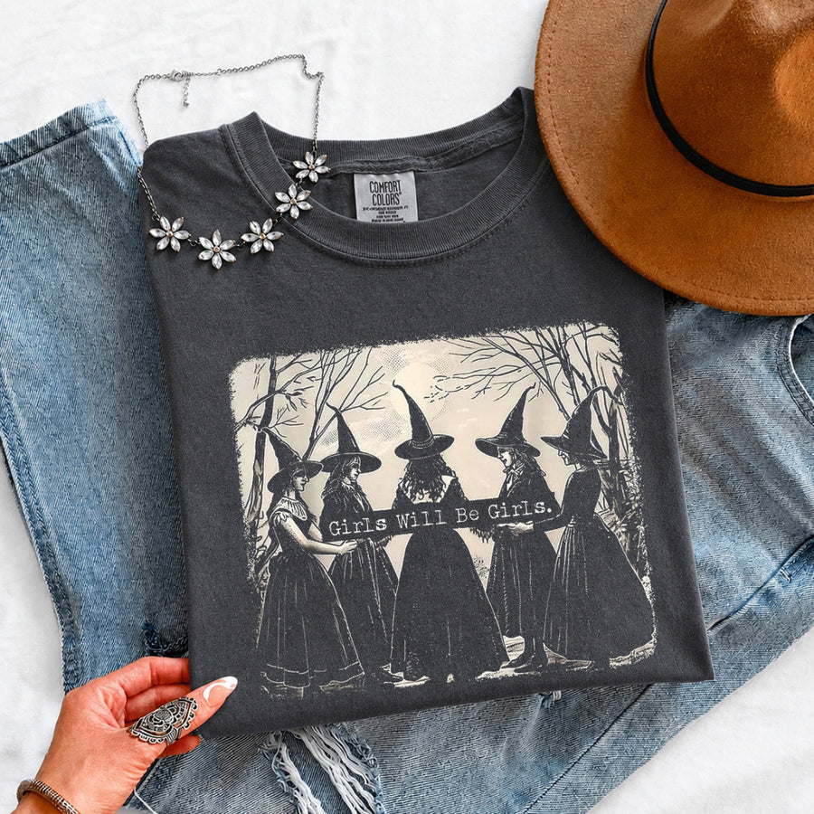 May include Girls Will Be Girls Comfort Colors Halloween t-shirt with festive graphic and relaxed unisex garment-dyed fit