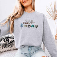 May include Gossip Like Charlotte Wigs crewneck sweatshirt with elegant period drama graphic and cozy unisex fit