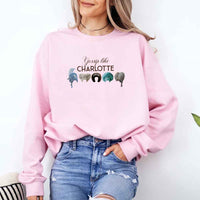 May include Gossip Like Charlotte Wigs crewneck sweatshirt with elegant period drama graphic and cozy unisex fit