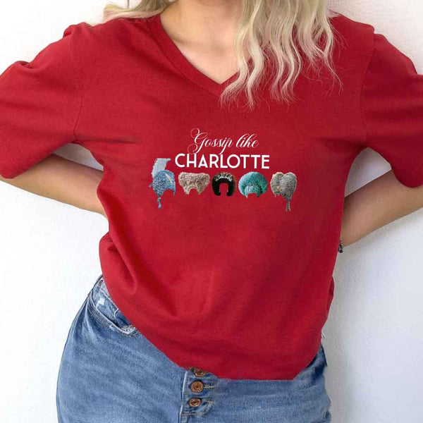 May include Gossip Like Charlotte Wigs v-neck tee with Regency romance BookTok graphic and relaxed fit design