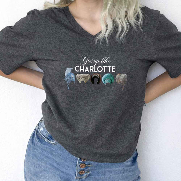 May include Gossip Like Charlotte Wigs v-neck tee with Regency romance BookTok graphic and relaxed fit design