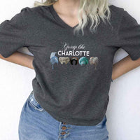 May include Gossip Like Charlotte Wigs v-neck tee with Regency romance BookTok graphic and relaxed fit design