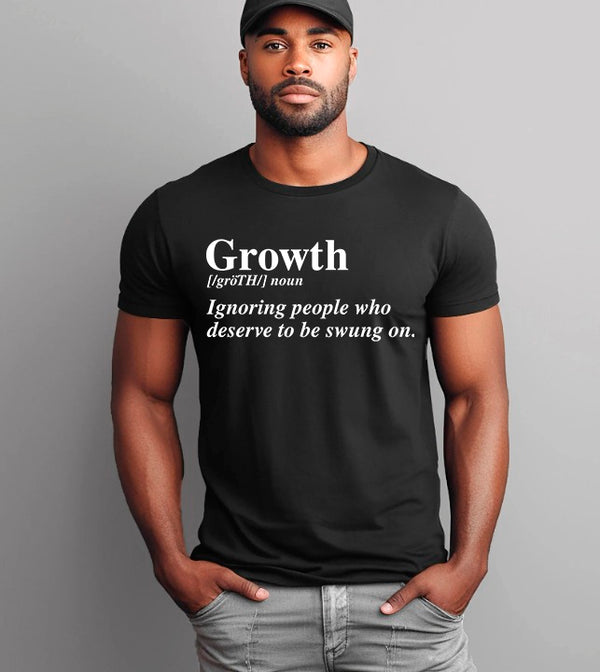 May include a unisex graphic t-shirt featuring the word “Growth” presented as a dictionary-style definition, paired with clean typography and an uplifting message that emphasizes progress, learning, and personal development.