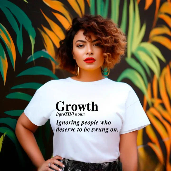 May include a unisex graphic t-shirt featuring the word “Growth” presented as a dictionary-style definition, paired with clean typography and an uplifting message that emphasizes progress, learning, and personal development.