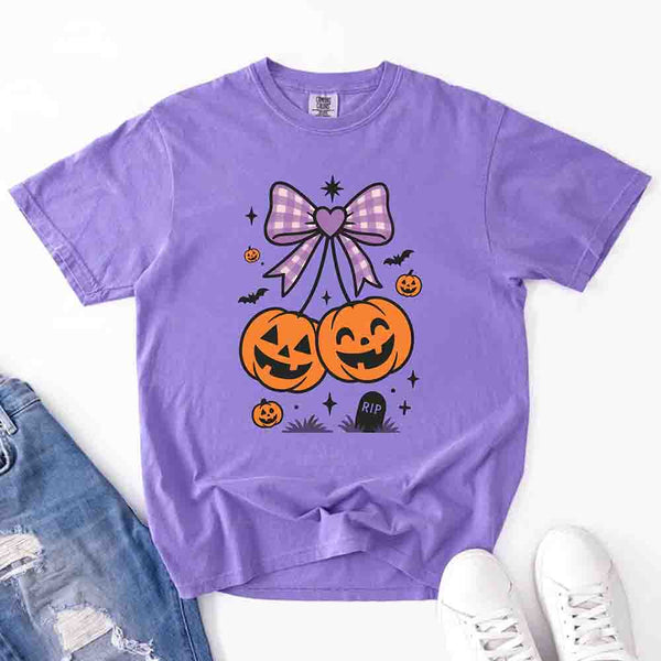 May include Halloween cherries graphic with two jack-o’-lantern pumpkins tied by a purple plaid bow, surrounded by bats, stars, and gravestone – cute spooky shirt design.
