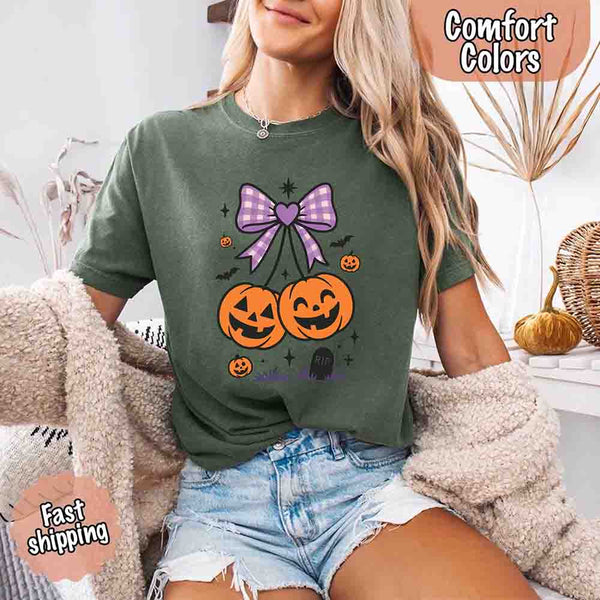 May include Halloween cherries graphic with two jack-o’-lantern pumpkins tied by a purple plaid bow, surrounded by bats, stars, and gravestone – cute spooky shirt design.