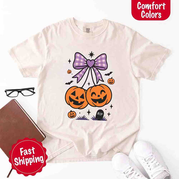 May include Halloween cherries graphic with two jack-o’-lantern pumpkins tied by a purple plaid bow, surrounded by bats, stars, and gravestone – cute spooky shirt design.