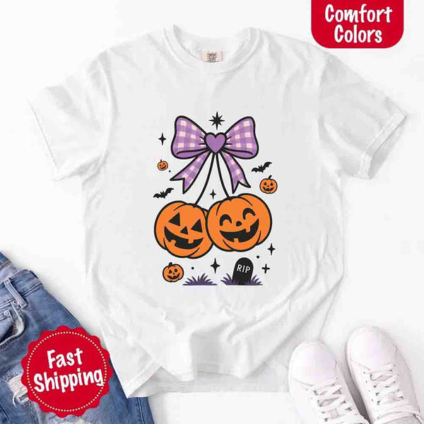 May include Halloween cherries graphic with two jack-o’-lantern pumpkins tied by a purple plaid bow, surrounded by bats, stars, and gravestone – cute spooky shirt design.