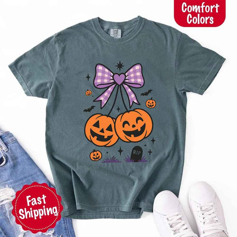 May include Halloween cherries graphic with two jack-o’-lantern pumpkins tied by a purple plaid bow, surrounded by bats, stars, and gravestone – cute spooky shirt design.