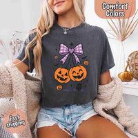 May include Halloween cherries graphic with two jack-o’-lantern pumpkins tied by a purple plaid bow, surrounded by bats, stars, and gravestone – cute spooky shirt design.