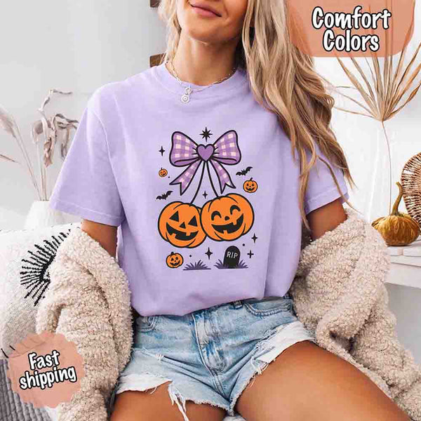 May include Halloween cherries graphic with two jack-o’-lantern pumpkins tied by a purple plaid bow, surrounded by bats, stars, and gravestone – cute spooky shirt design.