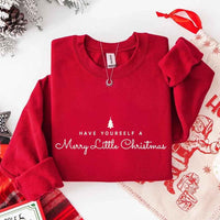 May include a soft unisex crew neck sweatshirt featuring the phrase “Have Yourself a Merry Christmas” in festive print, folded or displayed with warm holiday styling.