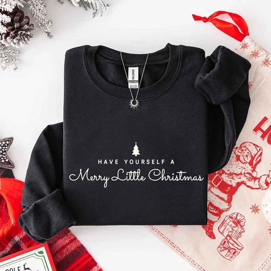 May include a soft unisex crew neck sweatshirt featuring the phrase “Have Yourself a Merry Christmas” in festive print, folded or displayed with warm holiday styling.