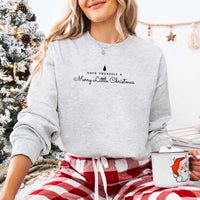 May include a soft unisex crew neck sweatshirt featuring the phrase “Have Yourself a Merry Christmas” in festive print, folded or displayed with warm holiday styling.