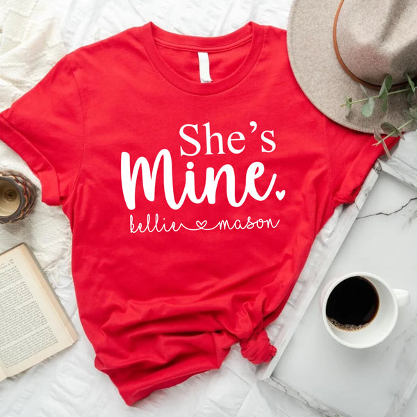 May include matching unisex t-shirts with “He’s Mine” and “She’s Mine” text and personalized names red t-shirt