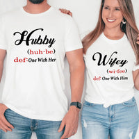 May include matching couple shirts with Hubby and Wifey text definition style, Hubby shirt saying ‘One With Her’ and Wifey shirt saying ‘One With Him’ in black and red font – Christian couple apparel.