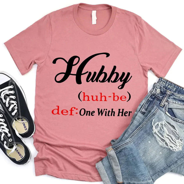 May include Hubby text graphic with definition style design, showing ‘Hubby (huh-be) def: One With Her’ in bold white font – Christian inspirational shirt.