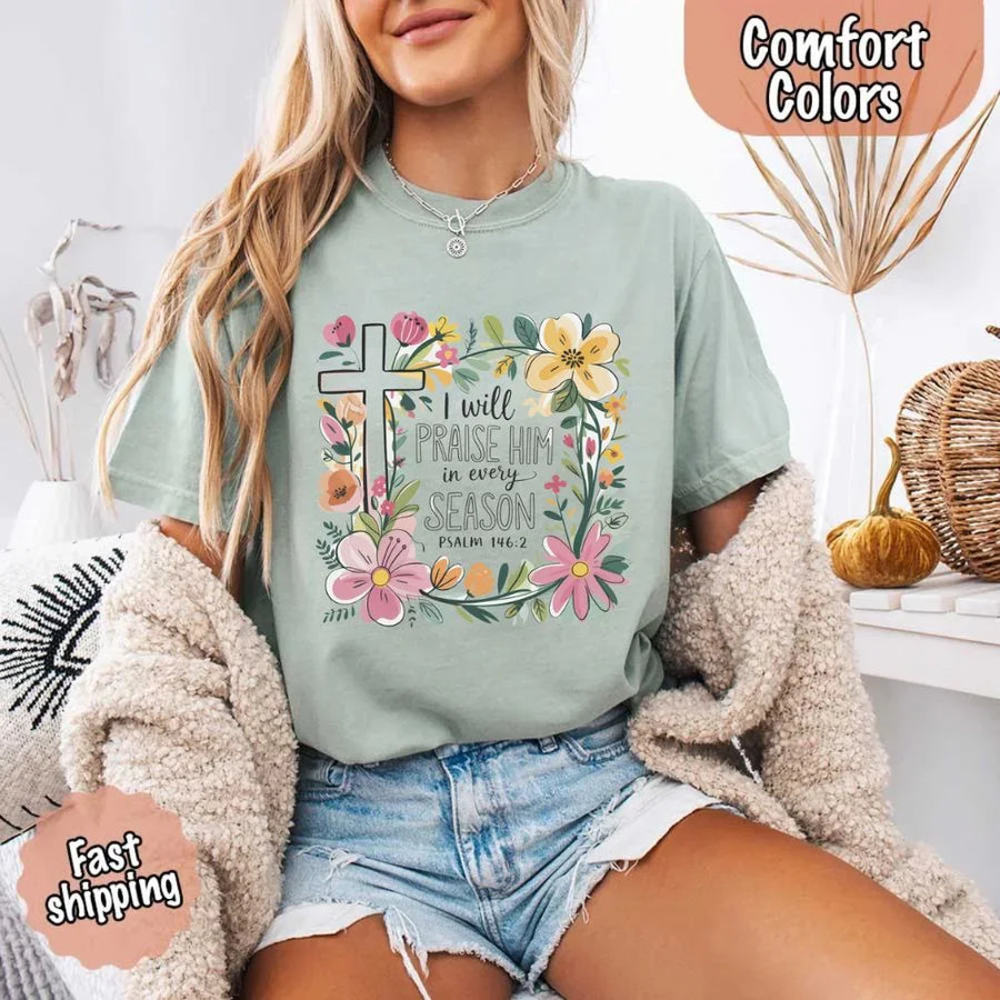 May include bold typography with a floral cross and the phrase “I Will Praise Him in Every Season,” reflecting faith and devotion through every stage of life.