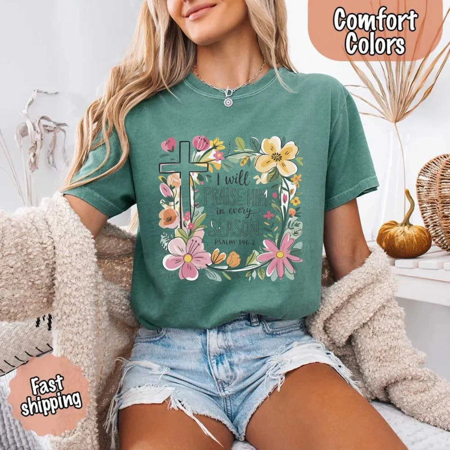 May include bold typography with a floral cross and the phrase “I Will Praise Him in Every Season,” reflecting faith and devotion through every stage of life.