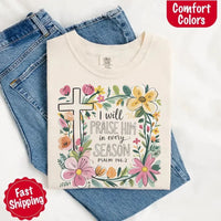 May include bold typography with a floral cross and the phrase “I Will Praise Him in Every Season,” reflecting faith and devotion through every stage of life.