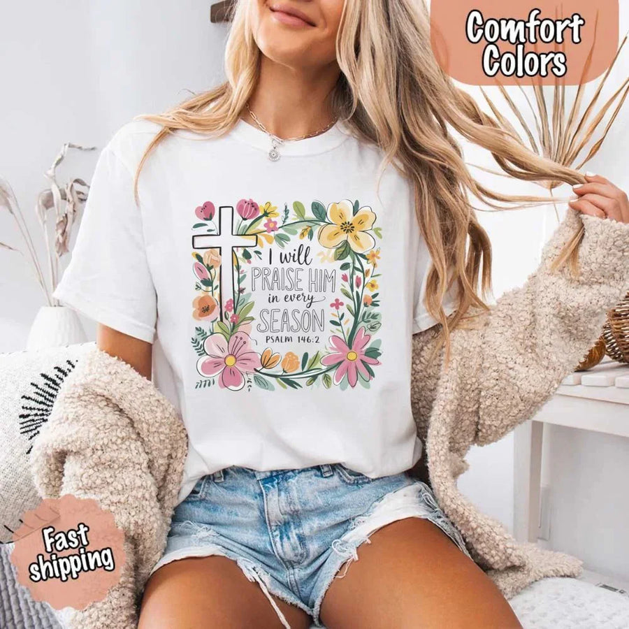 May include bold typography with a floral cross and the phrase “I Will Praise Him in Every Season,” reflecting faith and devotion through every stage of life.