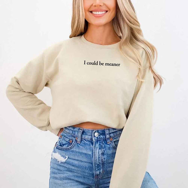 May include sarcastic “I Could Be Meaner” text printed on a classic unisex fleece crewneck sweatshirt
