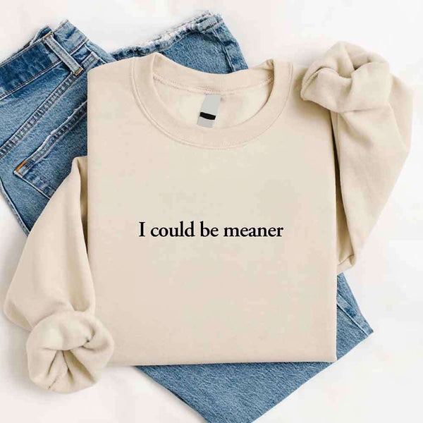 May include sarcastic “I Could Be Meaner” text printed on a classic unisex fleece crewneck sweatshirt
