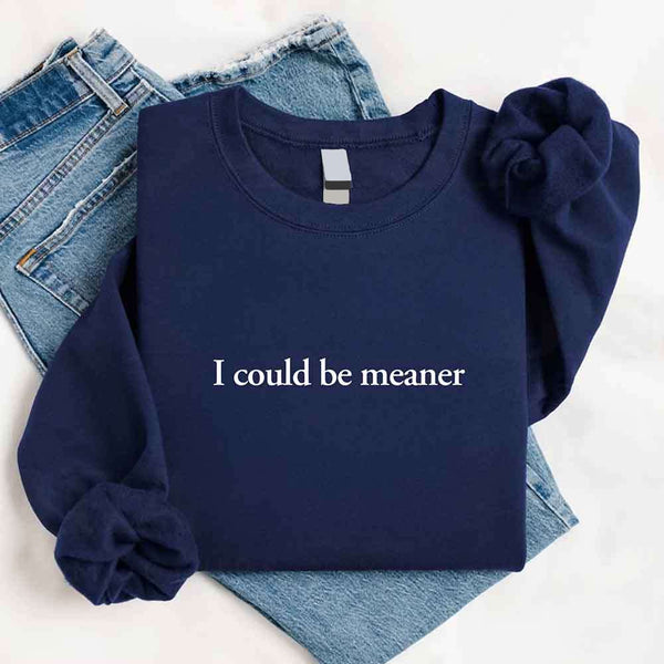 May include sarcastic “I Could Be Meaner” text printed on a classic unisex fleece crewneck sweatshirt