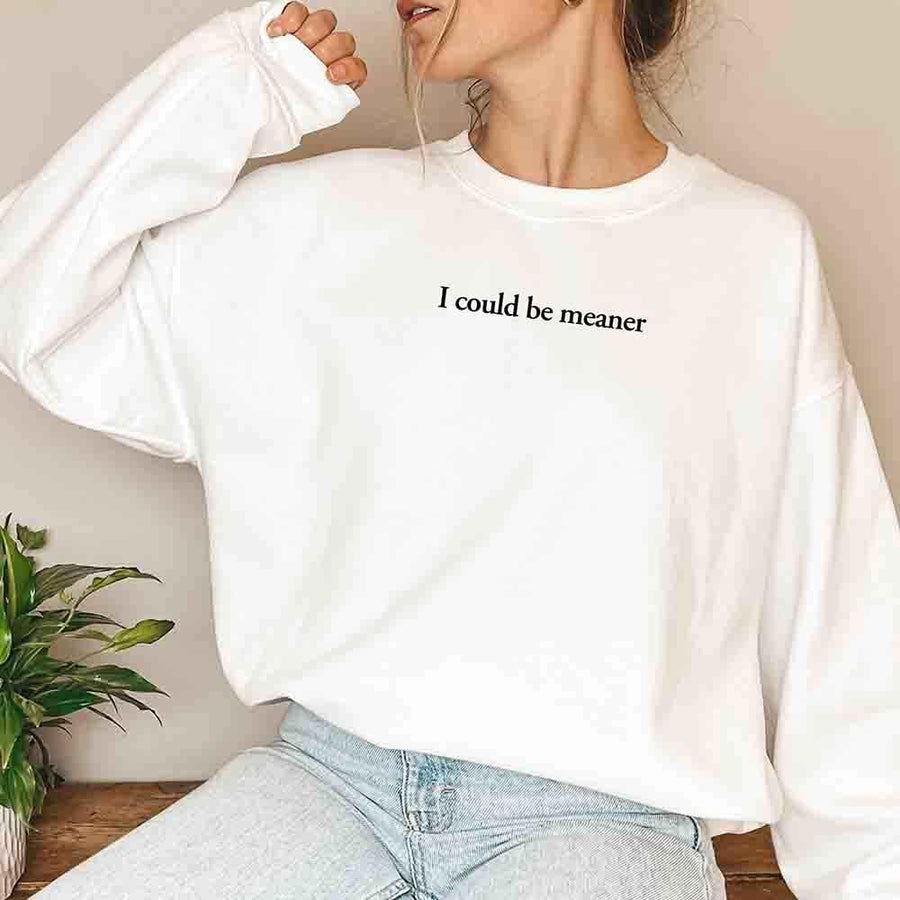 May include sarcastic “I Could Be Meaner” text printed on a classic unisex fleece crewneck sweatshirt