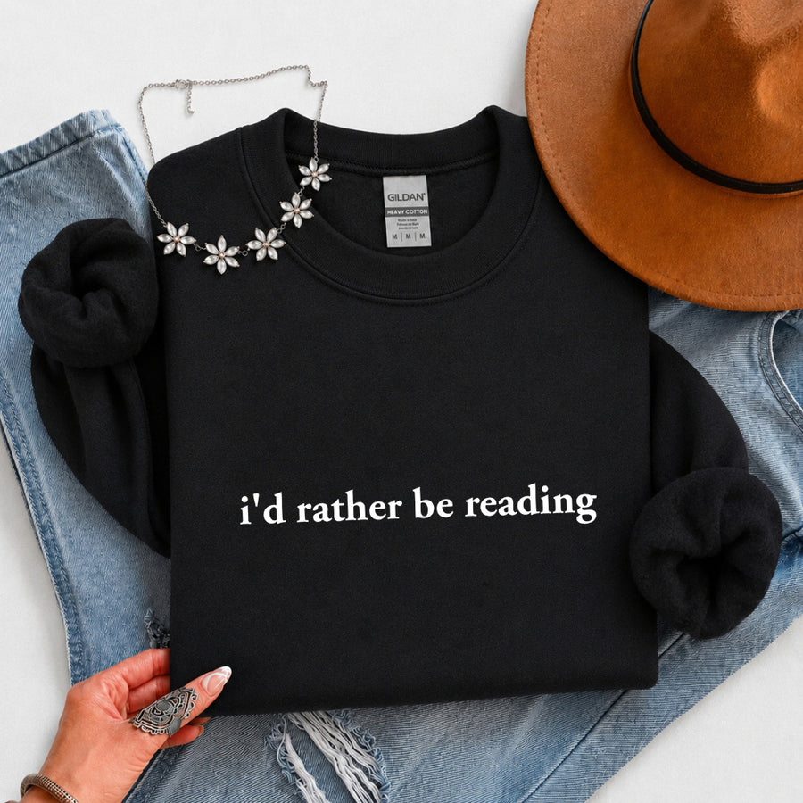 May include an I’d Rather Be Reading Book Lover Sweatshirt featuring a classic reading-inspired statement design on a cozy pullover.